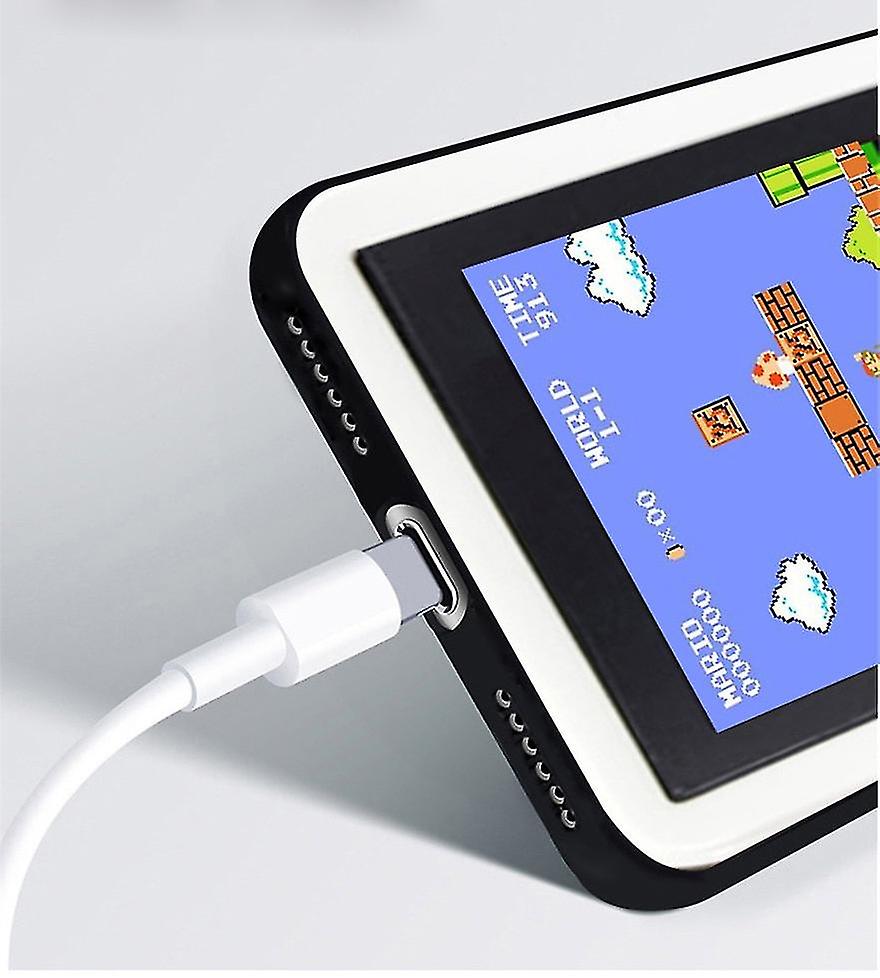 Small handheld device with a screen displaying a classic video game, connected to a cable.