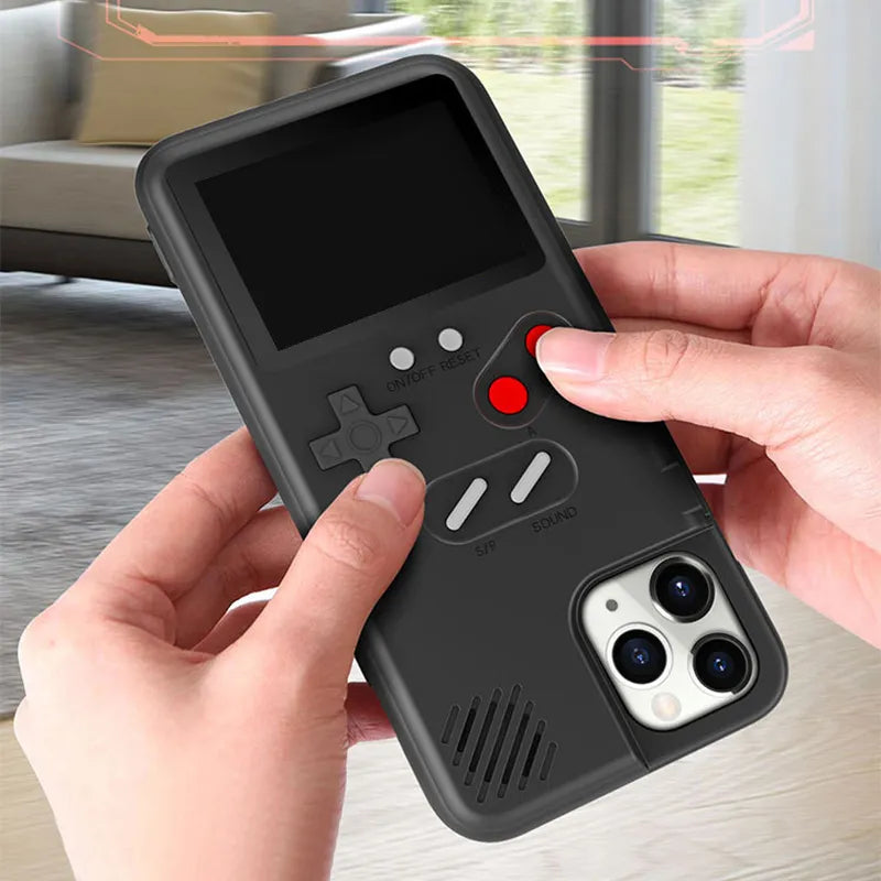 Phone case designed like a retro game console held by hands on a light surface.