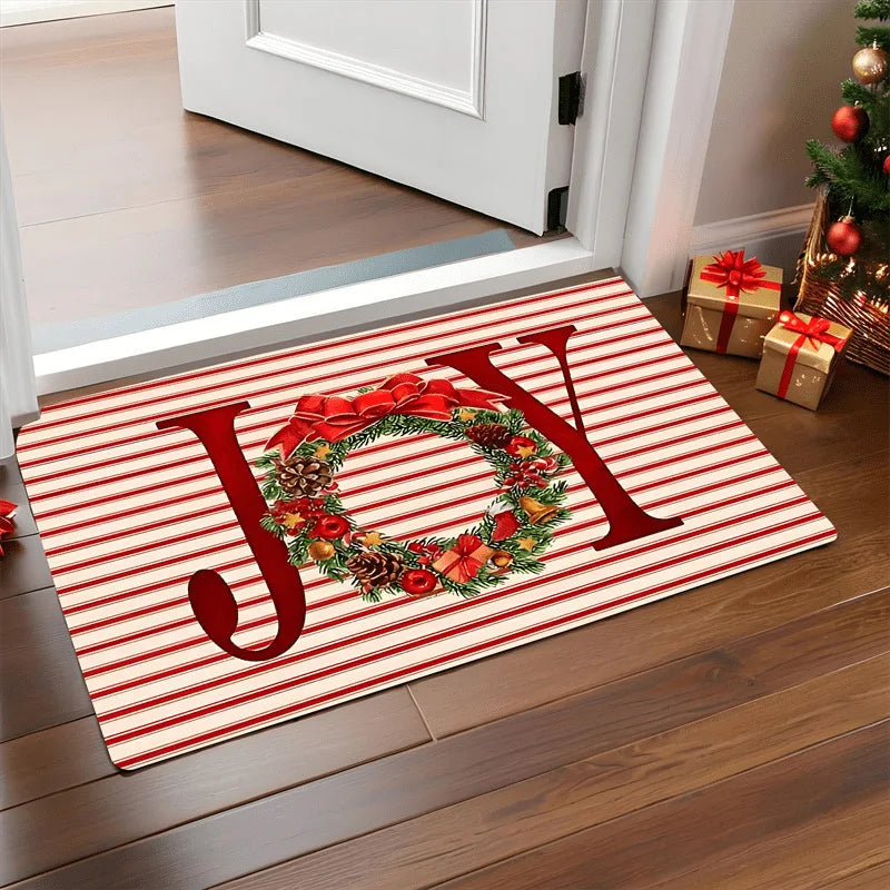 Christmas-themed doormat with 'JOY' and wreath design on a striped background